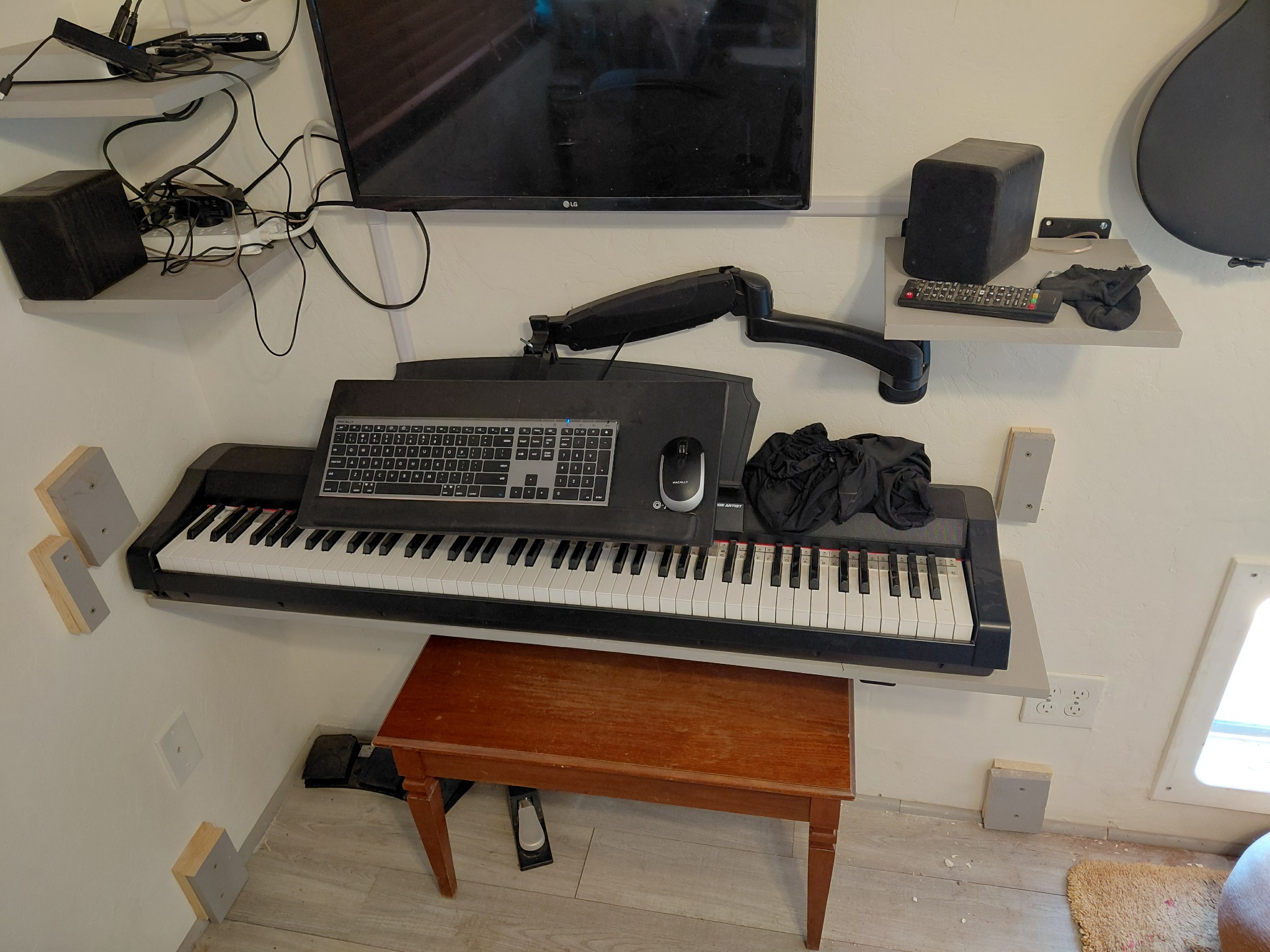 Keyboard balanced over digital piano